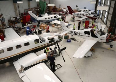 Image of aircraft maintenance inside hangar, FLY ASG.